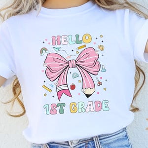 Hello 1st Grade Shirt, First Day of School Gift, Back To School Kids T-Shirt, 1st Grade Girls Coquette Bow Pencil Tee, First Grade Teacher