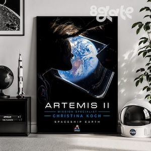 May include: A white ceramic mug with a black handle and the text "But First, Coffee" in a bold, black font. The mug is set against a blurred background, suggesting a cozy setting.