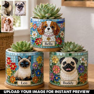 May include: Three mosaic-style pet planters with succulents. Each planter features a different pet: a Cavalier King Charles Spaniel named Bella, a Siamese cat named Leo, and a Pug named Buddy. The planters are decorated with colorful flowers.