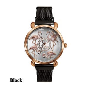 May include: A rose gold watch with a black mesh band. The watch face features five pink flamingo designs and a silver background. The word "Swat" is written in the center of the watch face. The word "Black" is written at the bottom of the image.