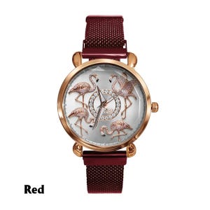 May include: A rose gold watch with a red mesh band. The watch face features five flamingo designs with crystal accents. The watch hands are silver. The word "Swat" is written in the center of the watch face. The word "Red" is written at the bottom of the image.