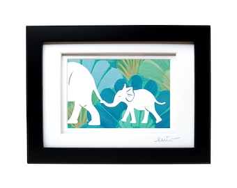 May include: A framed art print featuring a white silhouette of an adult elephant and a baby elephant holding tails against a background of teal, blue, and green tropical leaves. The artwork is encased in a black frame with a white mat board.
