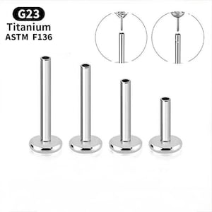 Pode incluir: Quatro labrets de titânio prateados com bases planas em forma de disco. Os labrets têm um poste cilíndrico e uma parte superior plana. A imagem inclui o texto "G23 Titanium ASTM F136" e diagramas dos componentes.