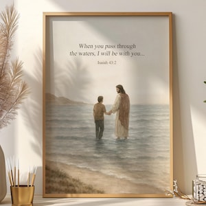 May include: Framed watercolor print featuring a biblical scene of two figures in water, with the text "When you pass through the waters, I will be with you... Isaiah 43:2." The artwork is set in a wooden frame.