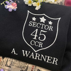 Embroidered Shatter Me Hoodie, Aaron Warner Shatter Me 45 Sector CCR Uniform Sweatshirt, A Warner Sweatshirt