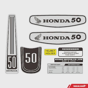 May include: A set of adhesive decals for a Honda 50 motorcycle, including two elongated silver emblems with the Honda wing logo, a vertical stripe with the number 50, a shield-shaped 50 decal, and several rectangular safety and tire pressure labels.