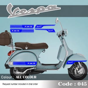 May include: A light blue Vespa scooter featuring a brown seat and a brown rear storage bag. The scooter displays blue graphic decals with the text P 200 XE and Vespa. The image includes the text Vespa, Colour: ALL COLOUR, and Code: 045.