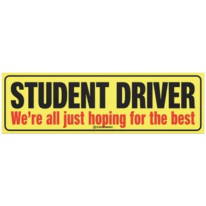May include: A rectangular yellow bumper sticker with black text that reads "STUDENT DRIVER" above the red text "We're all just hoping for the best". The sticker has a black border.