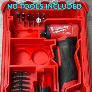 May include: Red tool case containing a black and red power drill and various accessories. The case has the text "NO TOOLS INCLUDED". The drill is branded "Milwaukee FUEL" and includes a battery pack.