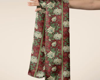 May include: A long rectangular scarf featuring a deep burgundy background with a repeating pattern of cream-coloured chrysanthemum flowers and green leaves. The scarf includes vertical green stripes and the text SEACLAIRE copyright 2026.