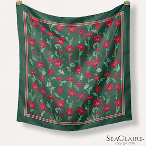 May include: A square scarf featuring a dark green background with a repeating pattern of red poppy flowers and green stems. The scarf is framed by a thin red and white border. The text "SEACLAIRE copyright 2026" is printed in the bottom right corner.
