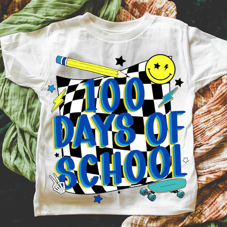 May include: White t-shirt with a colorful graphic design celebrating 100 days of school. The design includes a checkered background, a yellow pencil, a smiley face, stars, lightning bolts, a skateboard, and the text "100 DAYS OF SCHOOL".