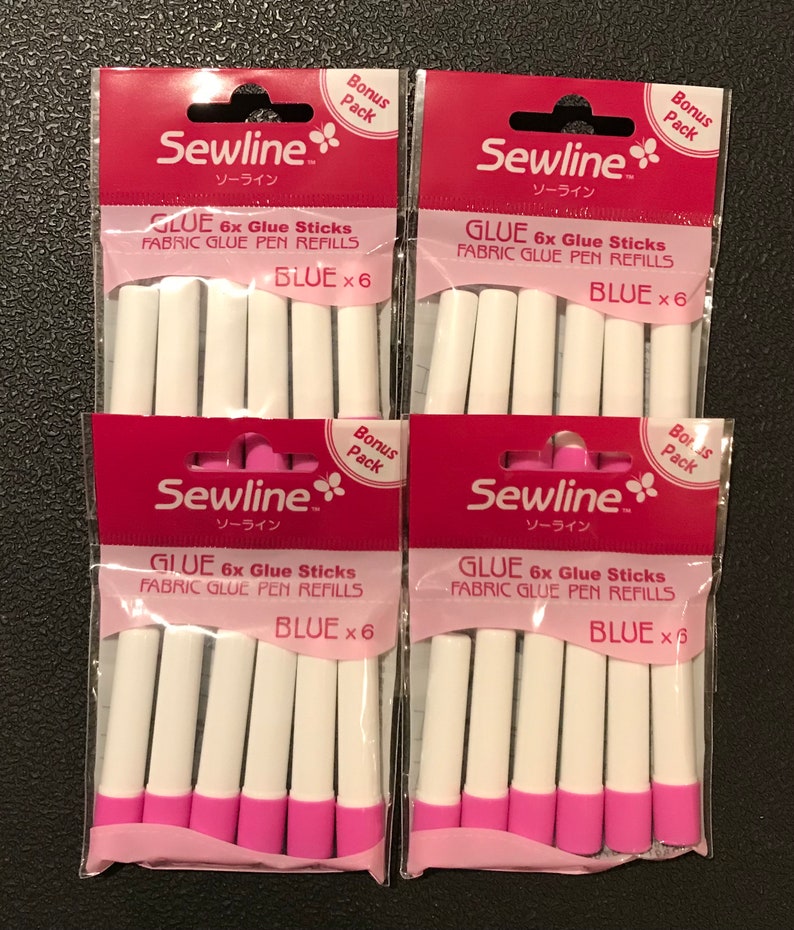 May include: Six blue fabric glue pen refills in a pink and white package with the brand name Sewline and the text "Bonus Pack" on the front.