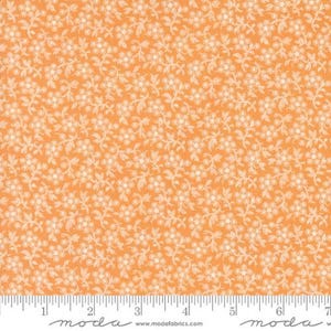 May include: Orange fabric with a white floral pattern. The fabric has a small-scale, repeating pattern of white flowers and leaves on a solid orange background.