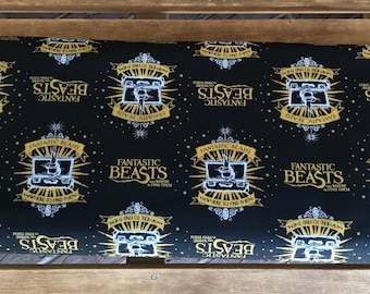 Fantastic Beasts / Black Logo and Suitcase With Metallics  - Camelot Fabrics - Wizarding World - 23900101