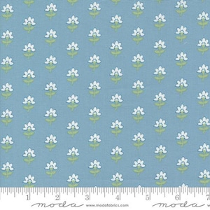 May include: A blue fabric with a white floral pattern. The fabric has a subtle texture and is perfect for quilting, sewing, and crafting.