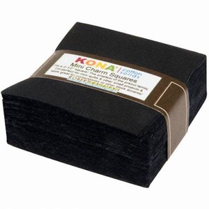 May include: A stack of black Kona Cotton Solids Mini Charm Squares, each measuring 2.5 inches. The label reads "Kona Cotton Solids Mini Charm Squares" and includes the text "The smallest of the precut family. Perfect for mini quilts & other small projects & cornerstones or other block accents."