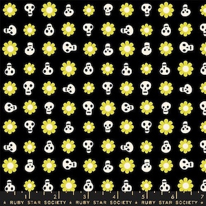 May include: Black and yellow fabric with a repeating pattern of skulls and flowers. The skulls are white and the flowers are yellow.