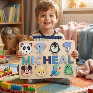 May include: A wooden puzzle featuring animal shapes and the name "MICHEAL" in blue letters. The puzzle includes a panda, elephant, penguin, dolphin, dog, cat, parrot, and turtle. A child is smiling and holding the puzzle.