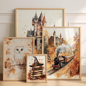 May include: A collection of framed watercolor prints featuring fantasy themes. Images include a castle, an owl on a branch, a stack of books with a witch's hat, and a train traveling through a forest. The frames are light wood.