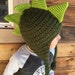dinosaur with mohawk on head