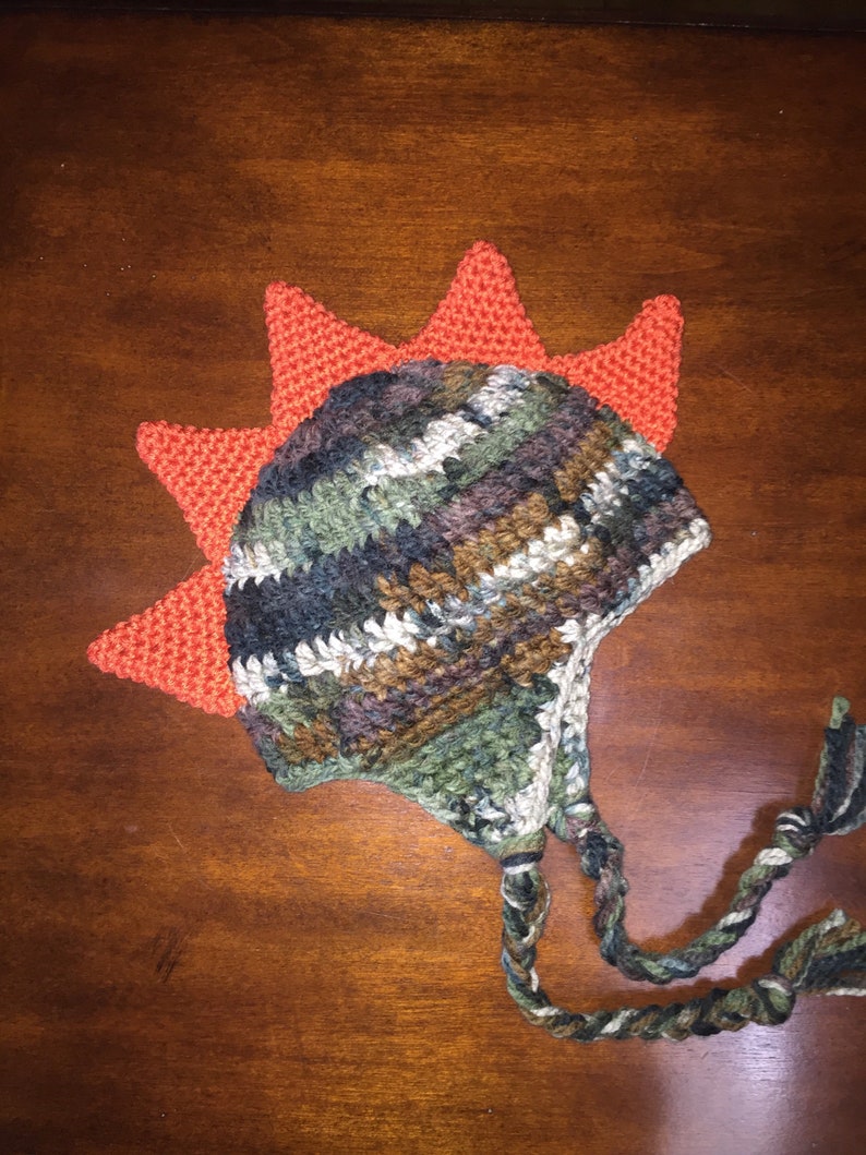 dinosaur with mohawk on head