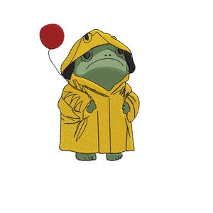 May include: An embroidered design of a green frog wearing a yellow raincoat with a black trim and hood. The frog is holding a red balloon on a black string. The frog has a serious expression.