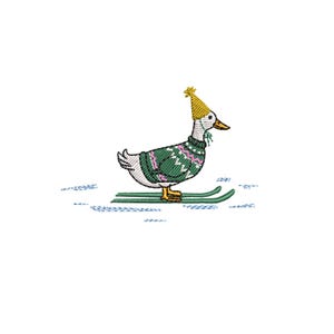 May include: An embroidered design of a goose wearing a green sweater with a pink and white pattern, a yellow hat, and skis. The goose is depicted on a white background with blue lines suggesting snow.