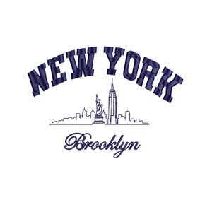 May include: White background with a navy blue embroidered design featuring the text "NEW YORK" in an arch, with a skyline silhouette including the Statue of Liberty and the Empire State Building. The word "Brooklyn" is written below the skyline.