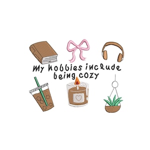 May include: An embroidered design featuring a brown book, pink bow, headphones, iced coffee, lit candle, and a hanging plant. The text "My hobbies include being cozy" is also included in the design.