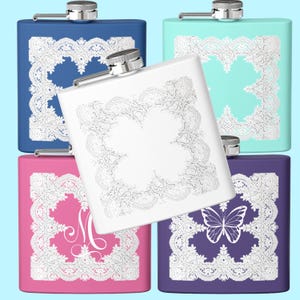 May include: A collection of square flasks in various colors: blue, mint green, white, pink, and purple. Each flask features a decorative white lace design. The purple flask has a butterfly design, and the pink flask has the letter "M".