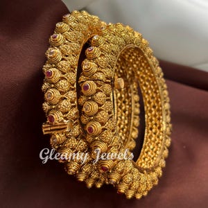 May include: A set of three ceramic mugs with a speckled, matte finish. The mugs are in shades of cream, light gray, and dark gray. Each mug has a simple, minimalist design, perfect for coffee or tea.