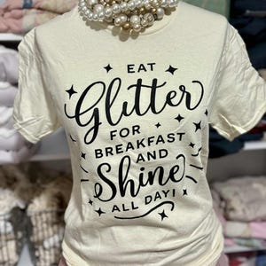 Eat Glitter for Breakfast and Shine All Day TShirt  Inspirational OffWhite Graphic Tee