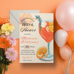 May include: A bridal shower invitation with a watercolor illustration of a cocktail with orange slices. The invitation includes the text "Please join us for a Bridal Shower Honoring Madison Williams" and event details. Balloons and flowers are in the background.
