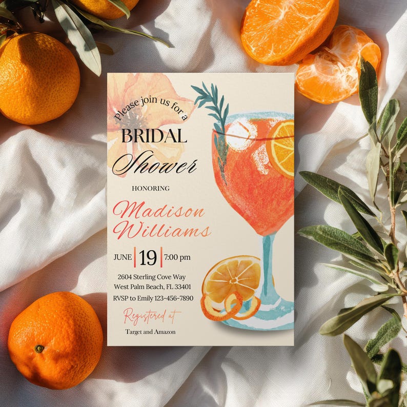 May include: A bridal shower invitation featuring a watercolor illustration of a cocktail with orange slices. The invitation includes the text "Please join us for a Bridal Shower" and details for Madison Williams' shower on June 19th.