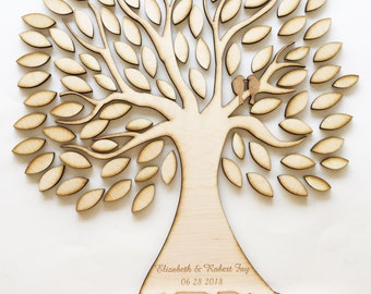 May include: A wooden tree cutout with leaves and two birds on a branch. The tree is personalized with the names "Elizabeth & Robert Tay" and the date "06 28 2018".