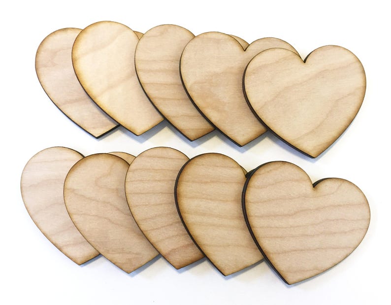 May include: Ten unfinished wooden heart shapes, each with a natural wood color and a dark brown outline.