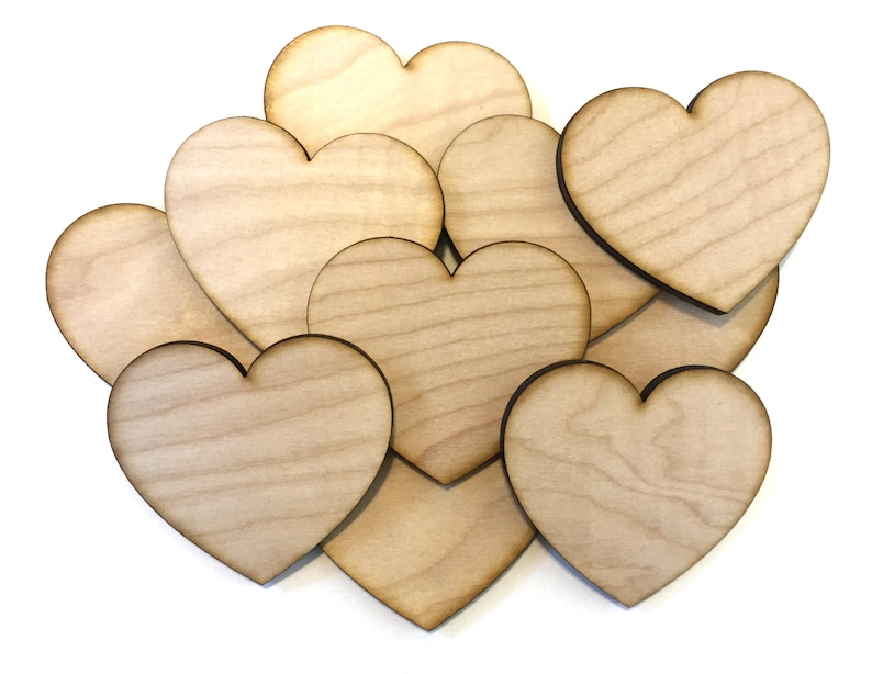 May include: A group of eight unfinished wooden heart shapes, perfect for crafting and DIY projects.