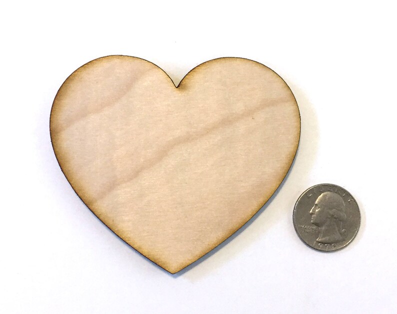 May include: A plain, unfinished wooden heart shape, approximately the size of a US quarter.