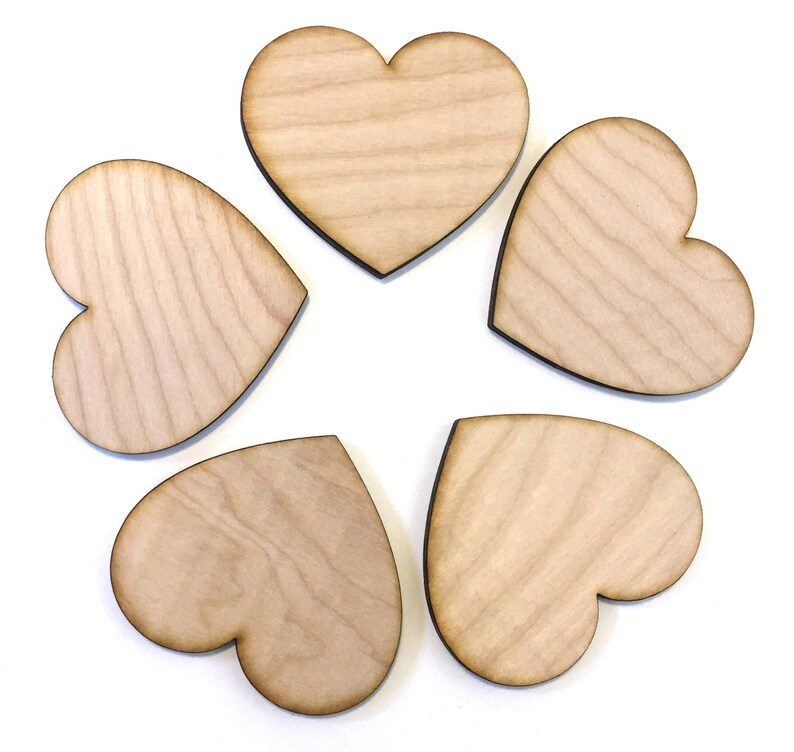 May include: Five unfinished wooden heart shapes, each with a natural wood grain pattern.