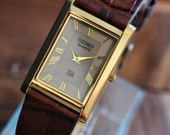 Reloj Seiko Tank vintage: fino tono dorado con una esfera gris inusual