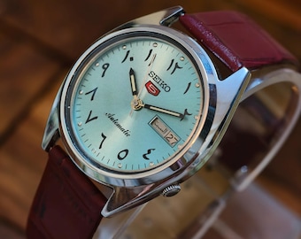 Vintage Seiko 5 Automatic Watch: Sky Blue Arabic Dial, Leather Strap