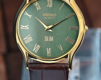 Reloj Seiko Slim vintage tono dorado – Esfera verde con números romanos, correa de cuero