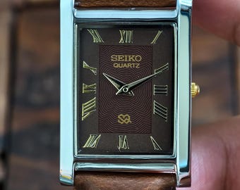 Reloj Seiko Slim Tank de cuarzo vintage con esfera marrón y números romanos, fabricado en Japón, unisex.
