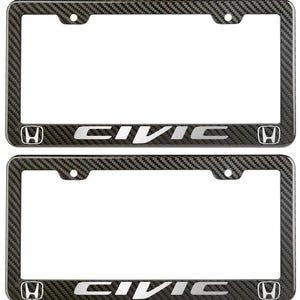 May include: Two carbon fiber license plate frames. Each frame has the word "CIVIC" in silver lettering and the Honda logo. The frames have a rectangular shape with mounting holes.