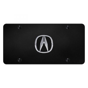 May include: Black license plate with the Acura logo in the center. The logo is a silver, stylized letter "A" inside a silver oval. Four black screws are in each corner of the plate.