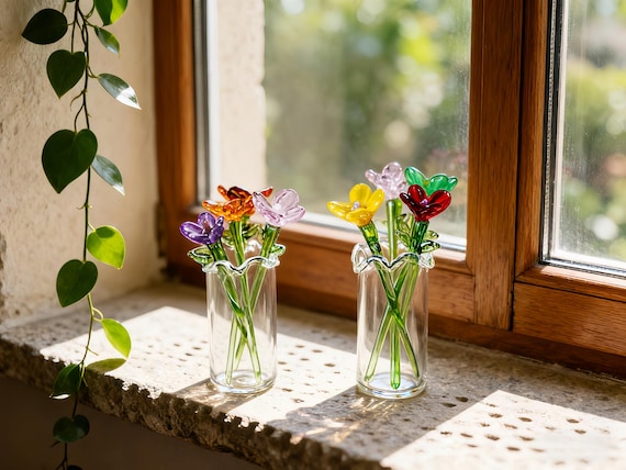 Tiny borosilicate glass flower bouquets hand-torched into miniature botanical sculptures — birthflower customization makes them feel genuinely personal and artisan.
