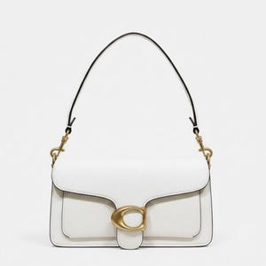 May include: White leather shoulder bag with a black strap and gold-tone hardware. The bag features a flap closure with a gold-tone clasp and a structured rectangular shape. The bag has a top handle and a detachable shoulder strap.