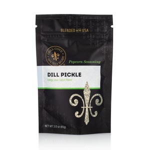 Front view of dill pickle popcorn seasoning pouch on white background. Dell Cove Spices