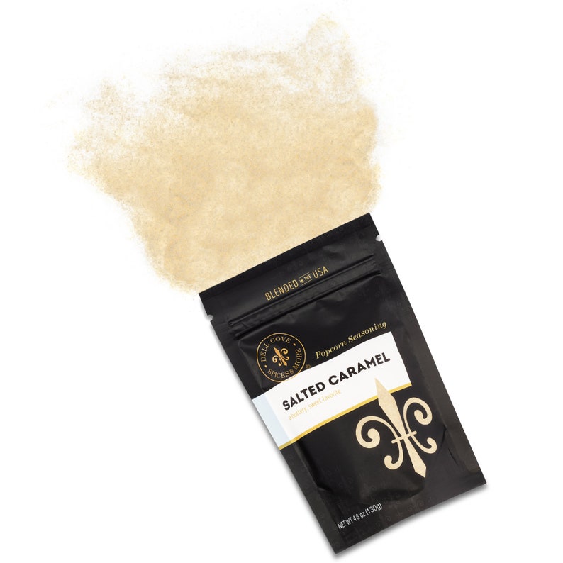 Salted caramel seasoning pouch laying down with seasoning spilling out the top. Dell Cove Spices